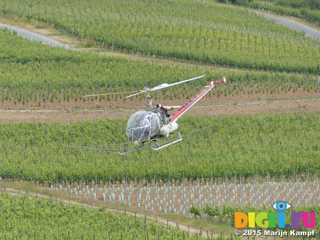 FZ017753 Helicoprter spraying vines